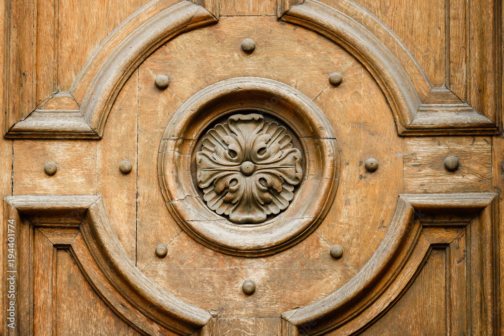 Wooden bas-relief of the old doors. Floral design. Wooden bas-relief of the old doors. Floral design.