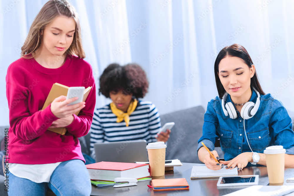 multicultural group of young students studying together multicultural group of young students studying together