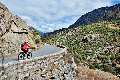 Corsica-cyclist on the way along the river Golo photo