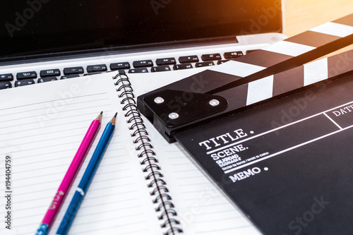 Video Editing,office stuff with Movie clapper laptop