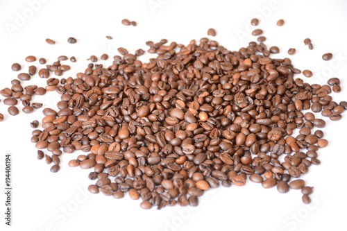 Black coffee scattered on a white background.
