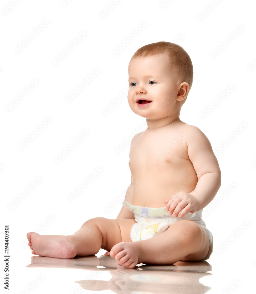 Infant child boy toddler sitting with plastic toy isolated Infant child boy toddler sitting with plastic toy isolated