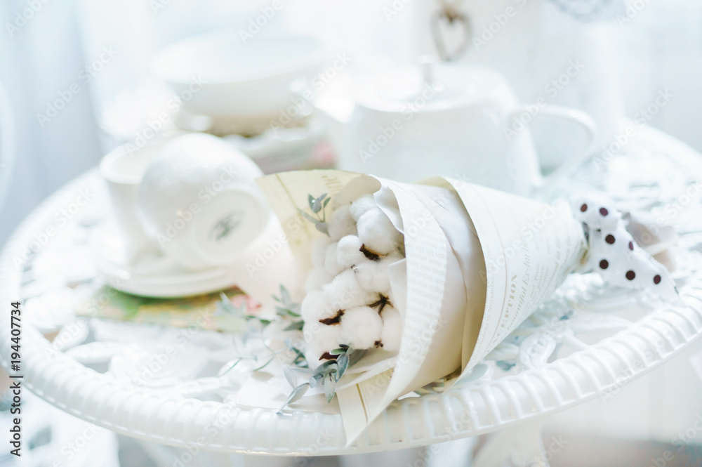 table with flowers and tea cups table with flowers and tea cups