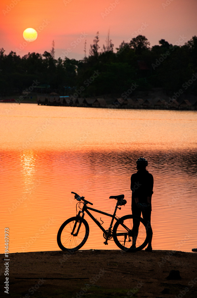 Fototapeta premium Woman and her bike in the morning
