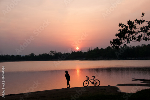 Woman and her bike in the morning