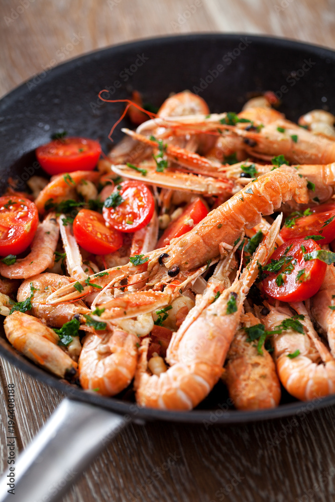Scampi cooked with tomatoes and parsley