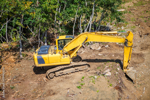 Photo of working excavator on summer day