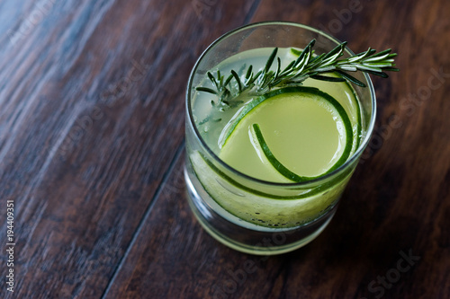 Rosemary Gin Gimlet Cocktail with Cucumber Slice.