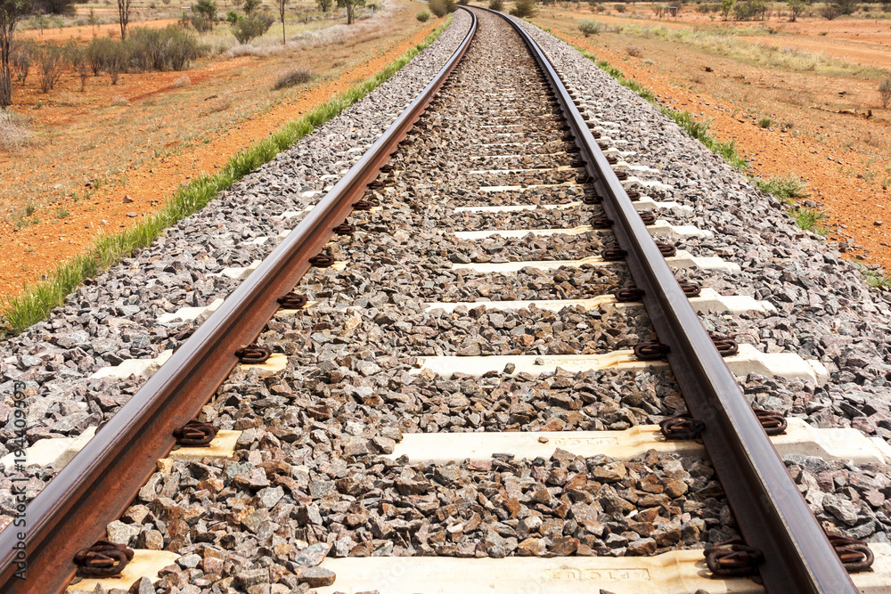 Empty railroad tracks  passing through Australian outback. 