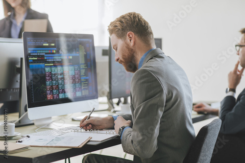 Stock Broker Working at Office photo