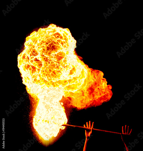 Fireshow, fire staff, explosion of fire on a black background