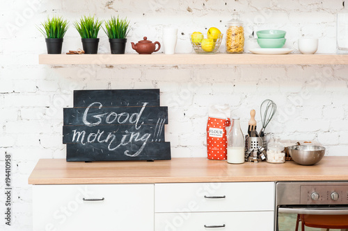 Morning kitchen with plate “Good morning!”.