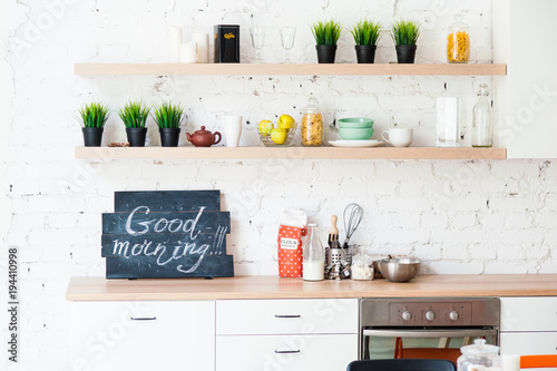 Morning kitchen with plate “Good morning!”.