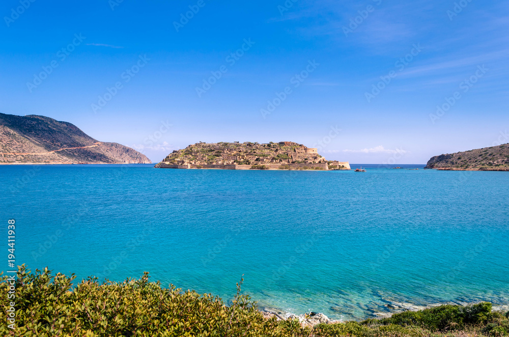 The island of Spinalonga is located in the Gulf of Elounda in north-eastern Crete opposite to the traditional fishing village of Plaka.In the past lepers were isolated there.