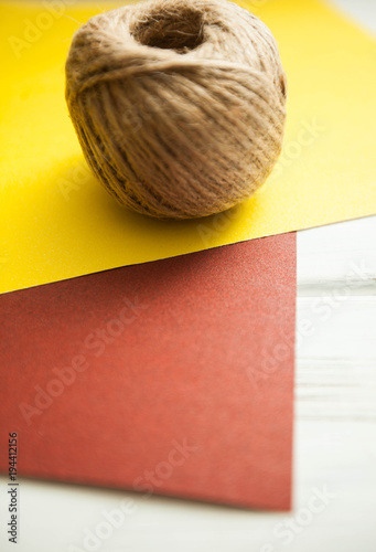 Repair carpenter tools: abrasive papper and rope on white old wooden background, top view, copy space