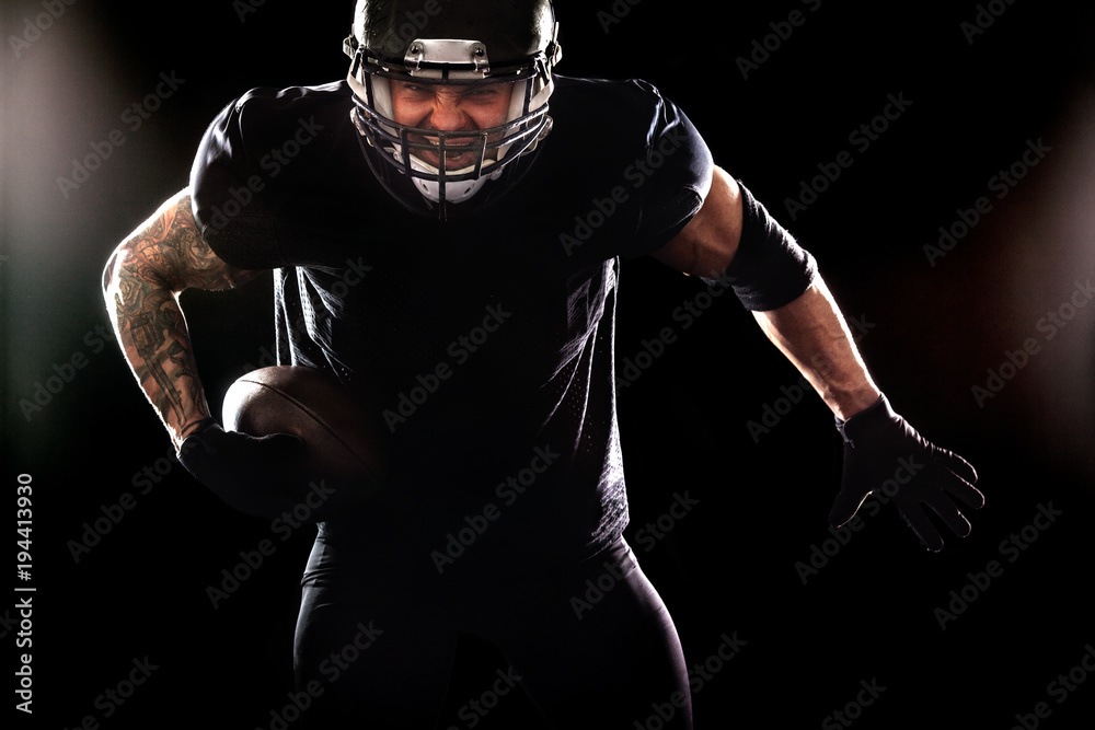 American football sportsman player isolated on black background