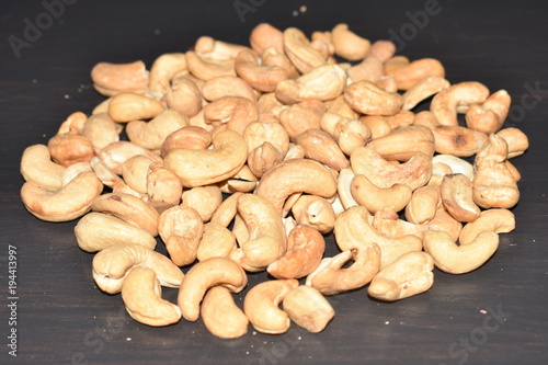 Cashew nuts on the black table, black background