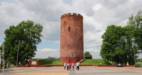 Kamyenyets, Brest Region, Belarus. People Walking Near Tower Of Kamyenyets In Summer Day photo