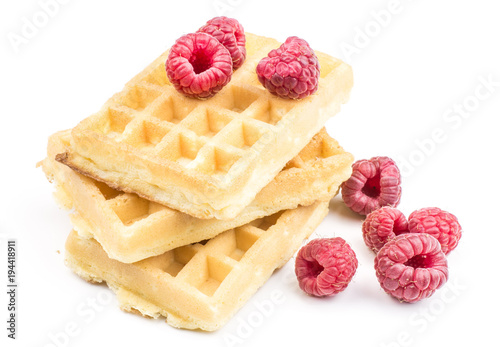 Traditional waffle (Belgian) with fresh red raspberries isolated on white background three sweet delicate and airy.