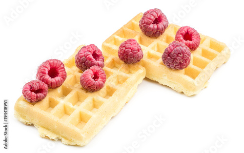 Traditional waffle (Belgian) with fresh red raspberries isolated on white background two sweet soft airy.