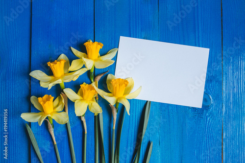 Fototapeta Naklejka Na Ścianę i Meble -  Flowers Greeting Card . Spring background with daffodils bouquet on wooden table