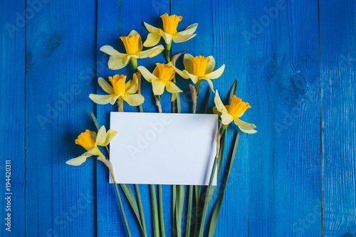 Fototapeta Naklejka Na Ścianę i Meble -  Flowers Greeting Card . Spring background with daffodils bouquet on wooden table