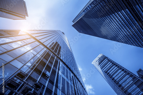 Low angle view of skyscrapers architectural glass photo