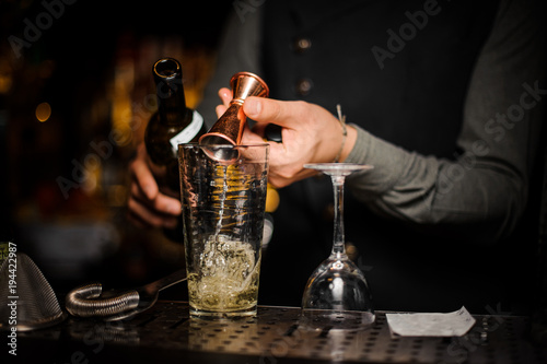 Barman making a fresh and tasty alcoholic cocktail