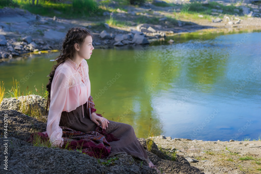 Beautiful young sad woman, dressed in the style of Boho
