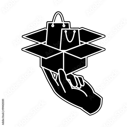 silhouette hand with shoping bag inside box package