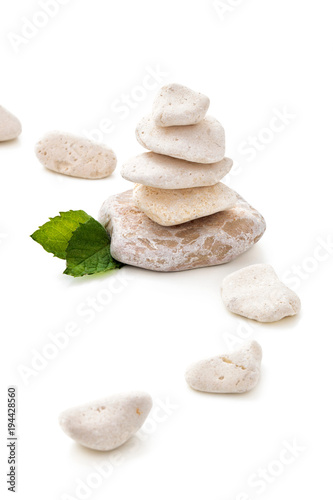 Balancing stones on white.