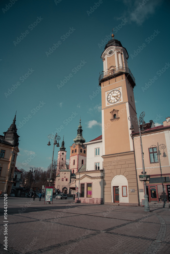 A vertical color image of Banska Bystrica Old Town, Main Square and Clock Tower. Captured Banska Bystrica, Slovakia