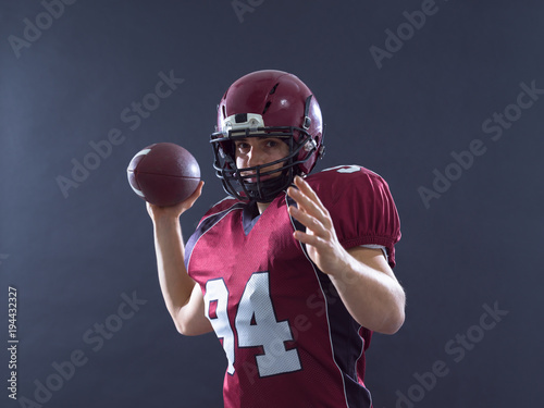 american football player throwing ball
