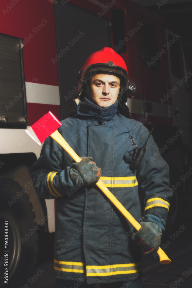 Fototapeta premium Firefighter with a tool