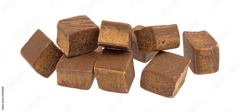Several chunks of butter chocolate fudge isolated on a white background. Several chunks of butter chocolate fudge isolated on a white background.