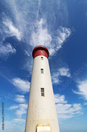  Red and White Lighthouse Extending Towards  Blue Cloudy Sky