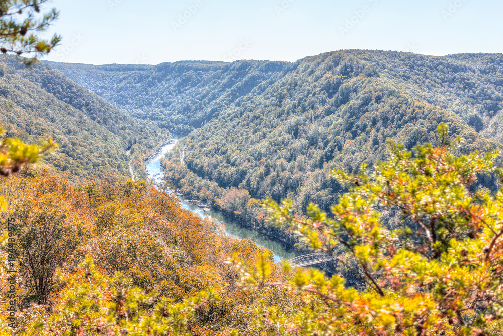 Overlook of West Virginia green, orange mountains in autumn fall at New River Gorge Bridge