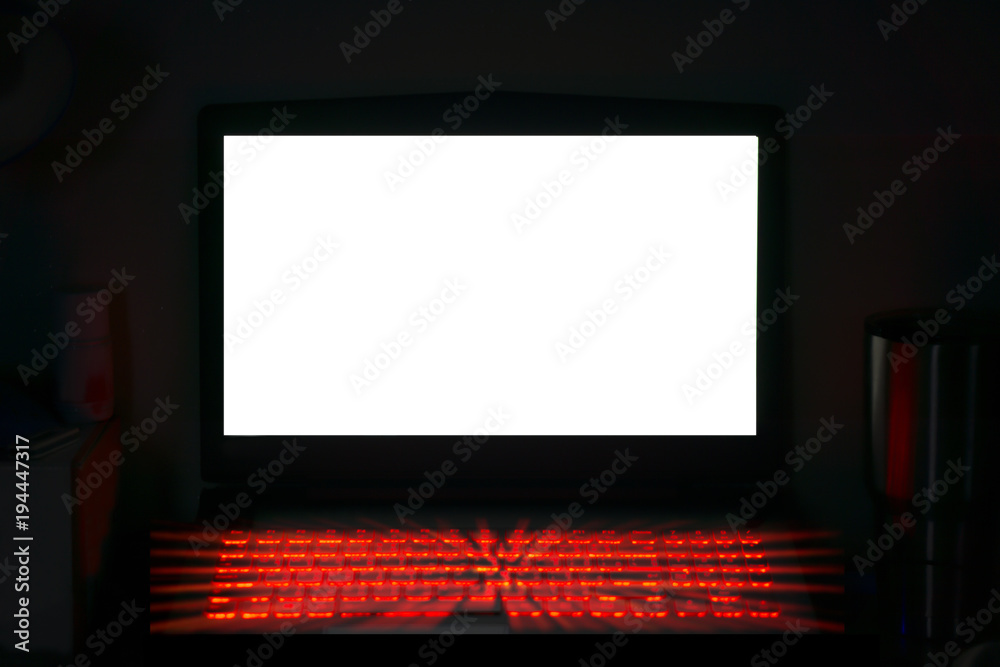 White monitor laptop for text and glowing red keyboard for hacking ,gaming concept