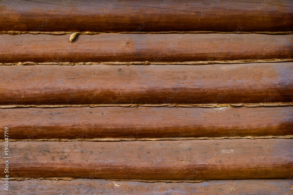 Wall made of wooden logs, background and surface Wall made of wooden logs, background and surface