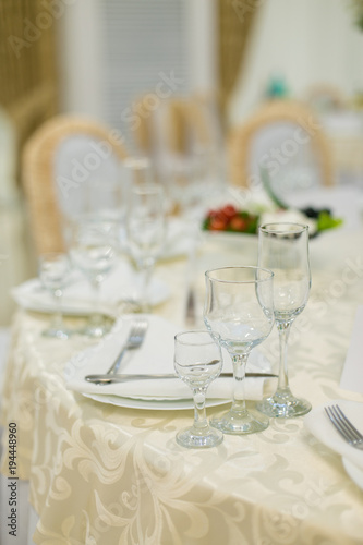 banquet hall of the restaurant, beautifully decorated tables with food