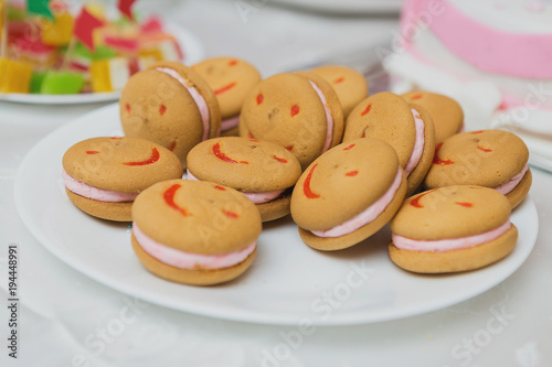 Funny cookies with smiles, sweets on the table