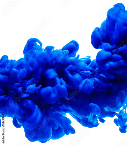 Ink blue colored paint pouring in water isolated on white background