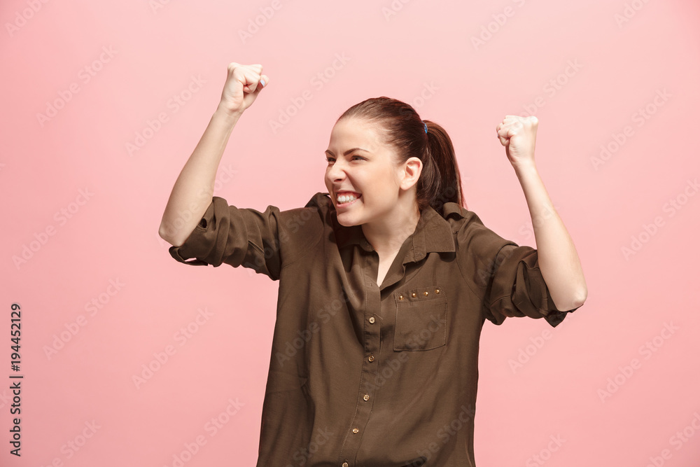 Winning success woman happy ecstatic celebrating being a winner. Dynamic energetic image of female model Winning success woman happy ecstatic celebrating being a winner. Dynamic energetic image of female model