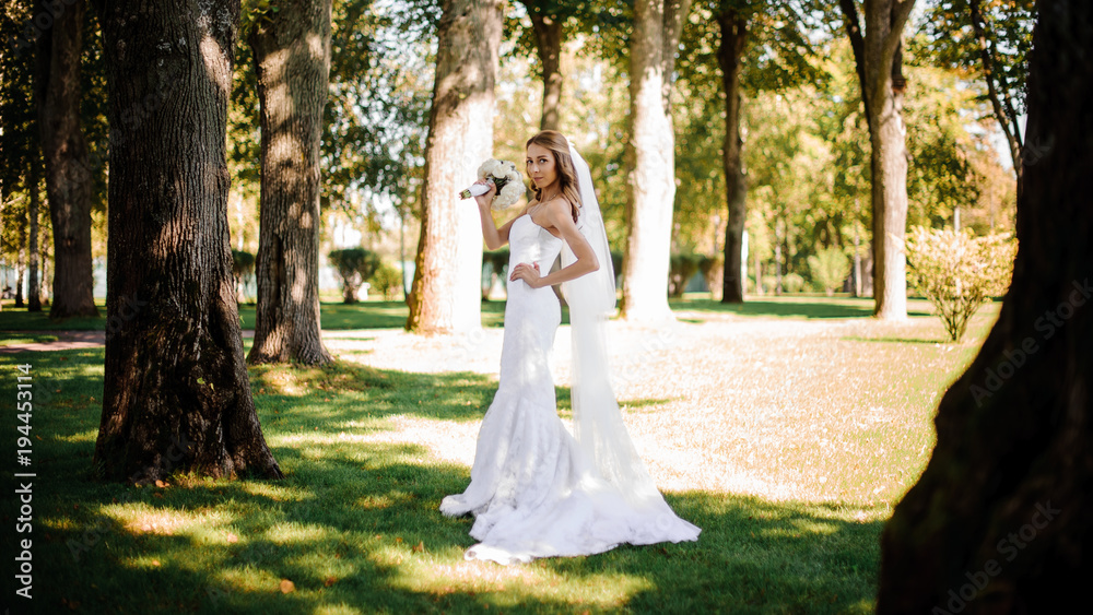 bride standing in a forest bride standing in a forest