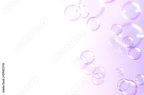 Abstract bright soap bubbles float in the air