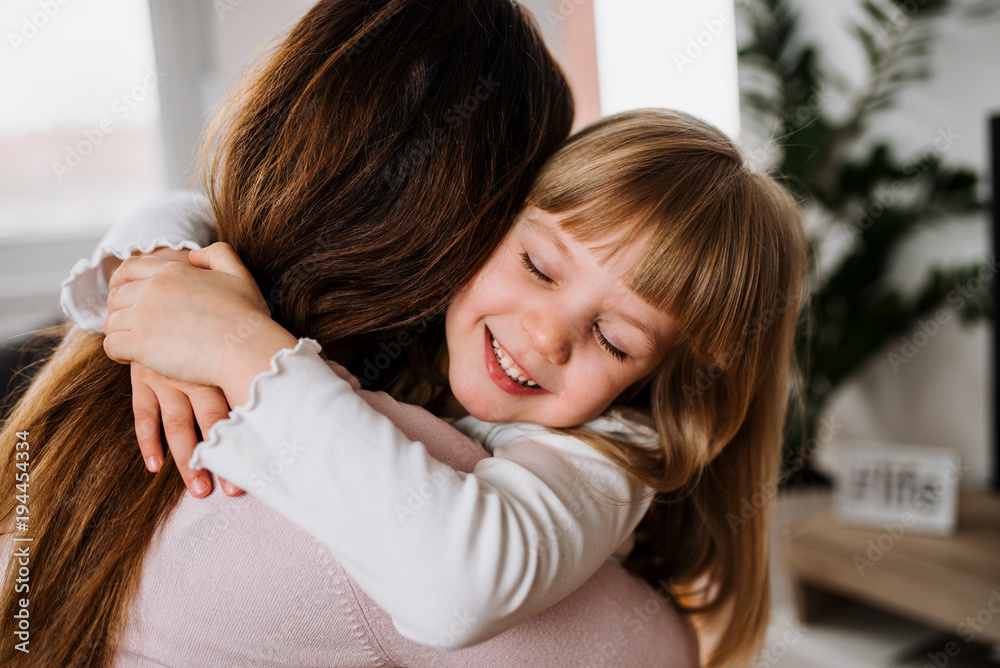 Mother and daughter hugging. Happy loving family. Mother and daughter hugging. Happy loving family.
