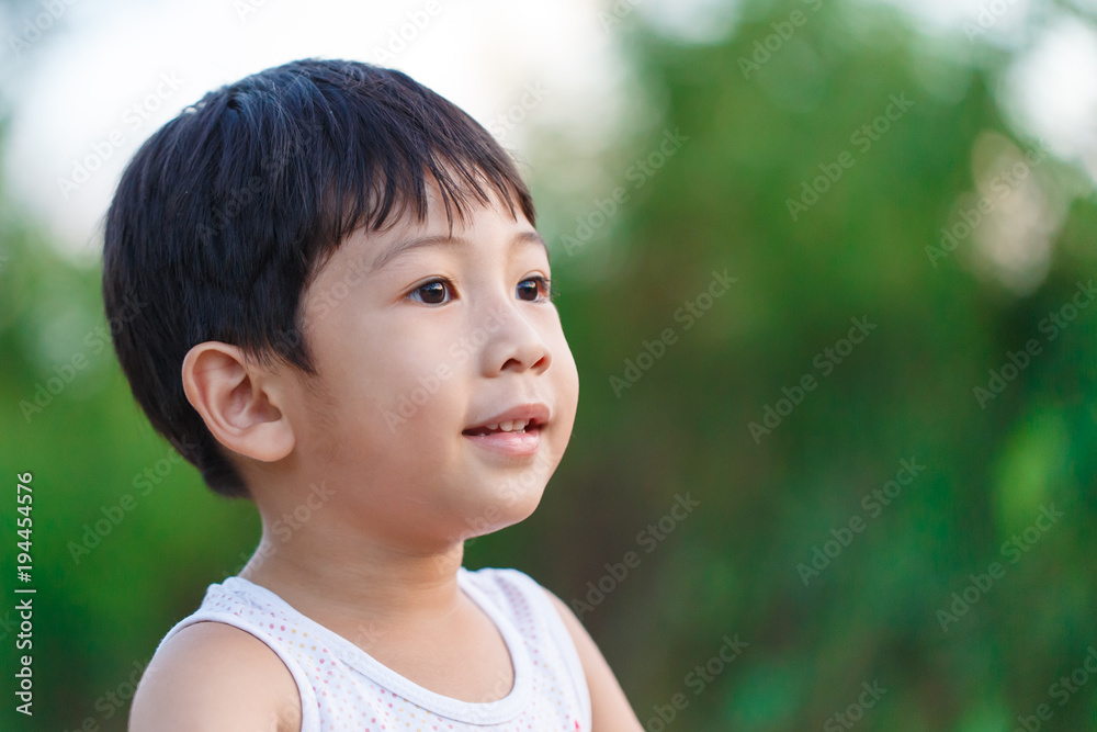 Little boy looking and smiling happily detail Little boy looking and smiling happily detail