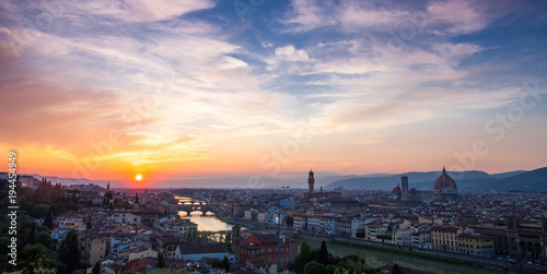 Sunset over bridges through the river Arno in Florence