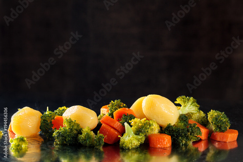 Steamed vegetables on tray.