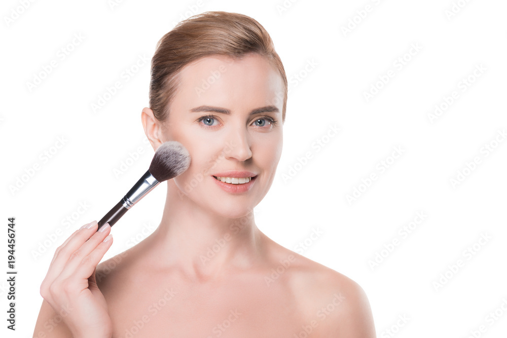 Woman with clean skin applying cosmetic powder isolated on white Woman with clean skin applying cosmetic powder isolated on white